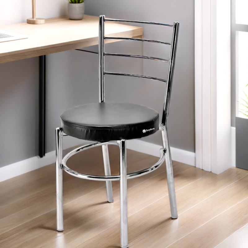 GOYALSON® Ergonomic dining chair designed for home, hotel, and restaurant use, featuring a durable chrome-polished frame and a comfortable leatherette seat for a stylish and sturdy seating solution.